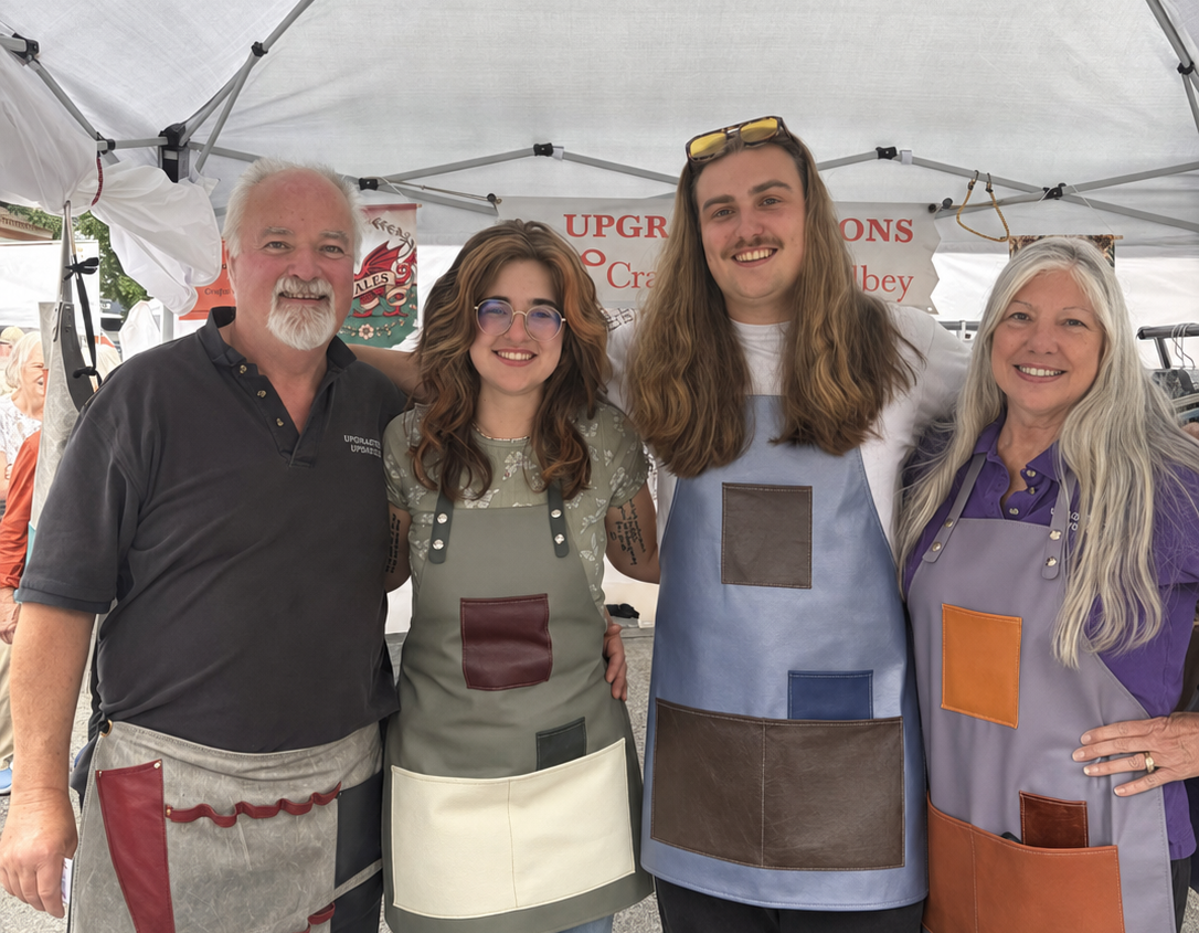 The Upgrade Aprons team wearing handmade leather aprons.